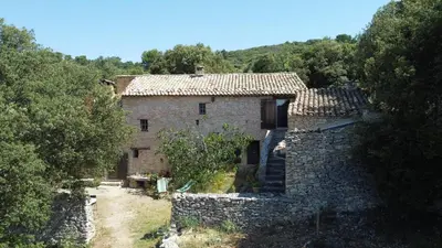 an old stone house in the middle of a forest at Le Jas des aiguiers in Saint-Saturnin-les-Apt