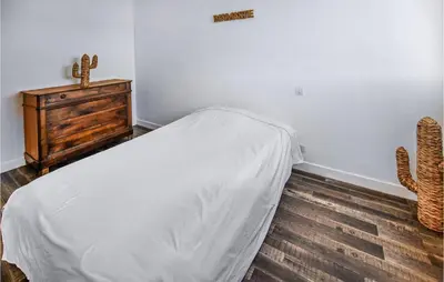 a bedroom with a bed and a cactus and a casserole at Nice Apartment In Carpentras With Wifi in Carpentras