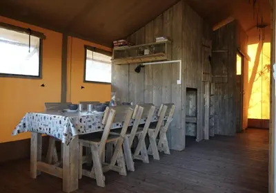 a dining room with a table and chairs at La Grisonne - Chalet3 in Revest-du-Bion