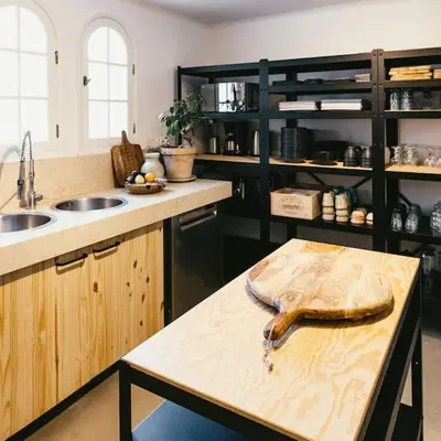 a kitchen with a table with a fish on it at Villa des Baumes in Cornillon-Confoux