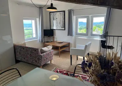 a living room with a couch and a table at Magic views in paradise in Joucas