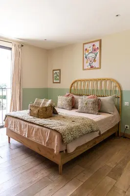 a bedroom with a large bed in a room at Maison style mas « le rougadou » in Noves