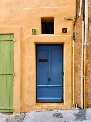 a blue door on the side of a building at Au cœur d’Aix-en-Provence in Aix-en-Provence