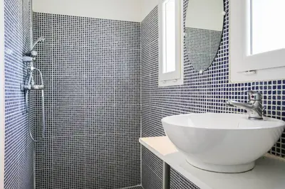 a bathroom with a white sink and a mirror at Superbe Mas contemporain au pied du Luberon in Cheval-Blanc