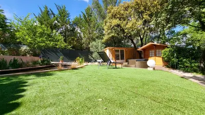 a small yard with a house and a lawn at La Tissonnière Oasis d Exception entre Mer Alpilles et Luberon Spa et Piscine à 10 min d Aix en Provence in Saint-Estève-Janson