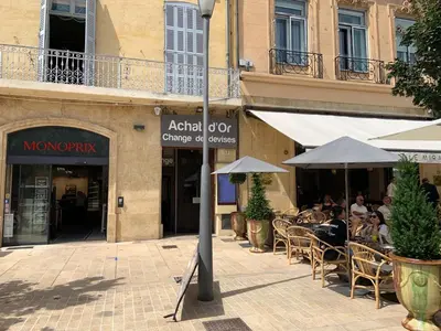 a group of people sitting at an outdoor restaurant at Studio de Luxe Aix en Provence in Aix-en-Provence