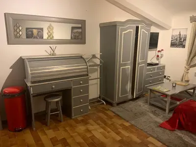 a bedroom with a desk and a dresser and a desk at Studio de Luxe Aix en Provence in Aix-en-Provence