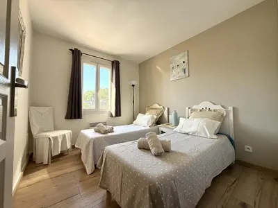 a bedroom with two beds and a window at Maison Calme 6 Pers. au Golf Pont Royal - Piscine, Terrasse, Parking, Clim, Fibre - 13370 Mallemort - FR-1-658-24 in Mallemort