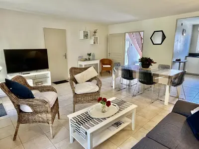 a living room with a couch and a table at Maison Calme 6 Pers. au Golf Pont Royal - Piscine, Terrasse, Parking, Clim, Fibre - 13370 Mallemort - FR-1-658-24 in Mallemort