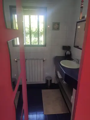 a bathroom with a sink and a window at Ferigoules #festivalavignon in Entraigues-sur-la-Sorgue