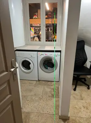 a laundry room with a washer and a washing machine at La villa castellas in Carpentras