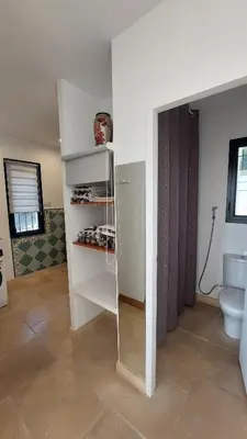 a bathroom with a toilet and a glass cabinet at Appartement entier Vue sur PAYS D Aix in Aix-en-Provence