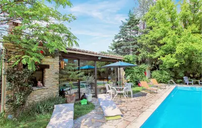 a house with a swimming pool and a patio at Beautiful Home In Carpentras in Carpentras