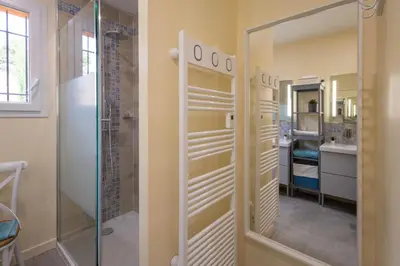 a bathroom with a shower and a walk in closet at L'Oliveraie in Saint-Saturnin-les-Apt