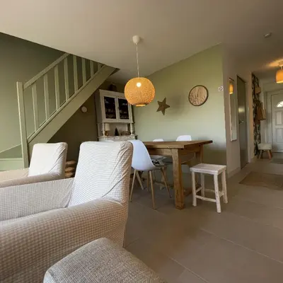 a living room with white couches and a staircase at Maison Le Clos Du Moulin 3 - Climatisée, jardin & parking gratuit - 3 chambres doubles - 10 min Avignon in Entraigues-sur-la-Sorgue