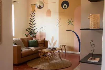 a living room with a couch and a table at Casëto Luberon in Apt