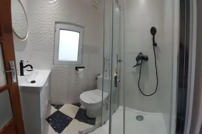 a bathroom with a shower and a toilet and a sink at Mon Ventoux in Modène
