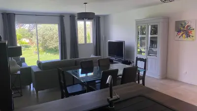 a living room with a couch and a table at Résidence Soleado Maison jumelée à 800m du centre ville de Bédoin in Bédoin