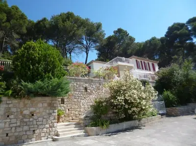 a house on top of a stone wall at Bastide vue exceptionnelle in Aix-en-Provence