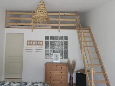 a bedroom with a loft bed and a desk at Mas Paolo Gite de charme en Provence Piscine in Le Thor