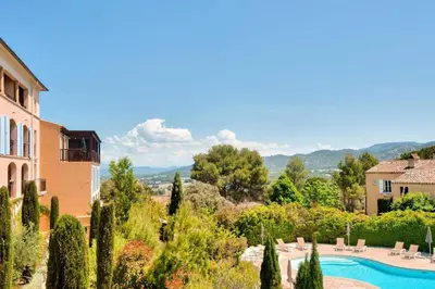 a view of a resort with a pool and trees at Village Pont Royal en Provence - maeva Home - Appartement climatisé 3 pièces 4 personnes - Prestige - super Home MAE-7124 in Mallemort