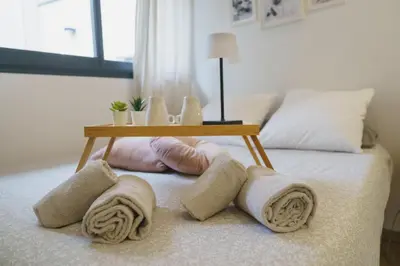 a table on top of a bed with towels on it at Cocon Classé 3 Etoiles - Love et Détente - SPA in Carpentras