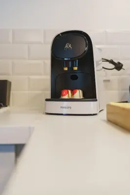 a toaster sitting on top of a counter at Cocon Classé 3 Etoiles - Love et Détente - SPA in Carpentras
