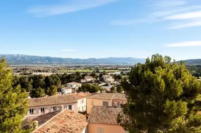 a view of a town with houses and trees at Les Coteaux de Pont Royal en Provence - maeva Home - Appartement 3 pièces 6 personnes - Prestige MAE-2554 in Mallemort