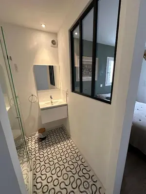 a small bathroom with a sink and a mirror at Villa climatisée avec piscine à St Remy in Saint-Rémy-de-Provence