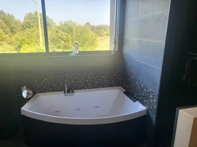 a bath tub in a bathroom with a window at Coin de paradis en Provence in Sault-de-Vaucluse