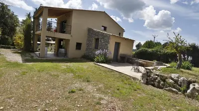 a house with a large yard in front of it at Coin de paradis en Provence in Sault-de-Vaucluse