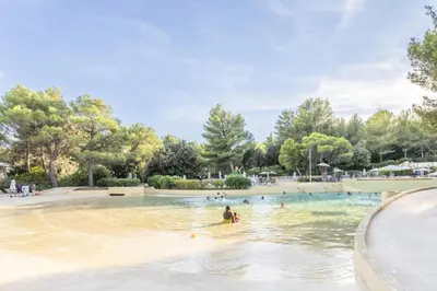 a group of people swimming in a swimming pool at Village Pont Royal en Provence - maeva Home - Appartement cosy et climatisé 2 pièces 4 personnes - Prestige - super Home MAE-2164 in Mallemort