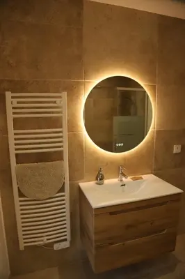 a bathroom with a sink and a mirror at La Bastide au coeur de la Provence in Pertuis