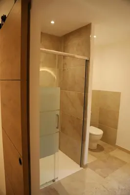 a bathroom with a shower and a toilet at La Bastide au coeur de la Provence in Pertuis