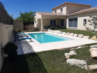a swimming pool in the backyard of a house at Olympe de Provence in Caromb