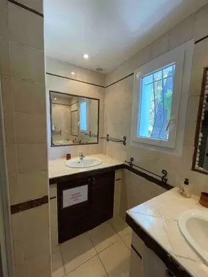 a bathroom with a sink and a mirror at Villa avec Piscine au coeur de la campagne provençale in Lançon-Provence
