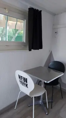a new year sign on a table and two chairs at studio 66 in Caumont-sur-Durance