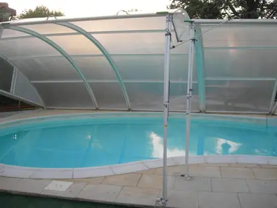 a pool with a cover over a swimming pool at studio 66 in Caumont-sur-Durance