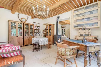 a kitchen with a table and chairs and a dining room at Mas du Rocher I Electio in Puget