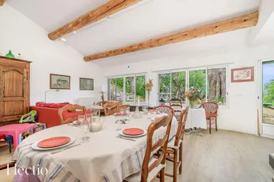 a dining room with a table and chairs at Mas du Rocher I Electio in Puget