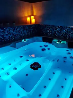 a bath tub with blue lighting in a room at A l'Orée du Pin in Puyricard