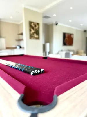 a pool table with two cue balls on it at Villa Saint Jean En Provence in Châteaurenard