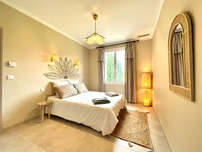 a bedroom with a bed and a window at Villa Saint Jean En Provence in Châteaurenard