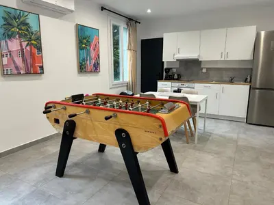 a ping pong table in the middle of a kitchen at Villa Saint Jean En Provence in Châteaurenard