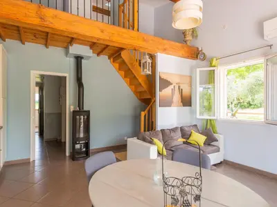 a living room with a couch and a table at Holiday Home in Vaucluse near Mont Ventoux in Pernes-les-Fontaines
