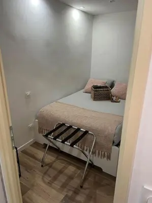 a small bedroom with a bed in a room at Chambre Mignet in Aix-en-Provence