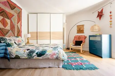 a bedroom with a bed and a dresser and a chair at Aude en Provence in Meyrargues
