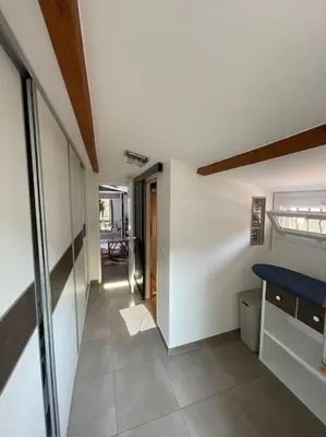 a hallway of a house with a blue bench in it at Charming Villa with pool, close to city center in Aix-en-Provence