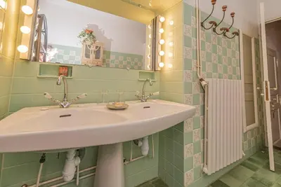 a bathroom with a sink and a mirror at Magnifique Mas Provençal in Lauris