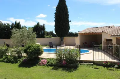 a villa with a swimming pool in a yard at Mas La Gentille ,,, à la campagne , beautiful outdoor , swimming pool , pool house , Nice green Garden , BBQ ,,, only for you , pour passer un séjour inoubliable in Pernes-les-Fontaines
